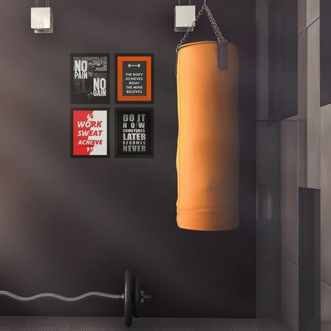 quotes wall frames on gym wall near punching bag